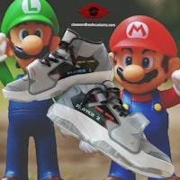 a pair of nintendo and mario shoes